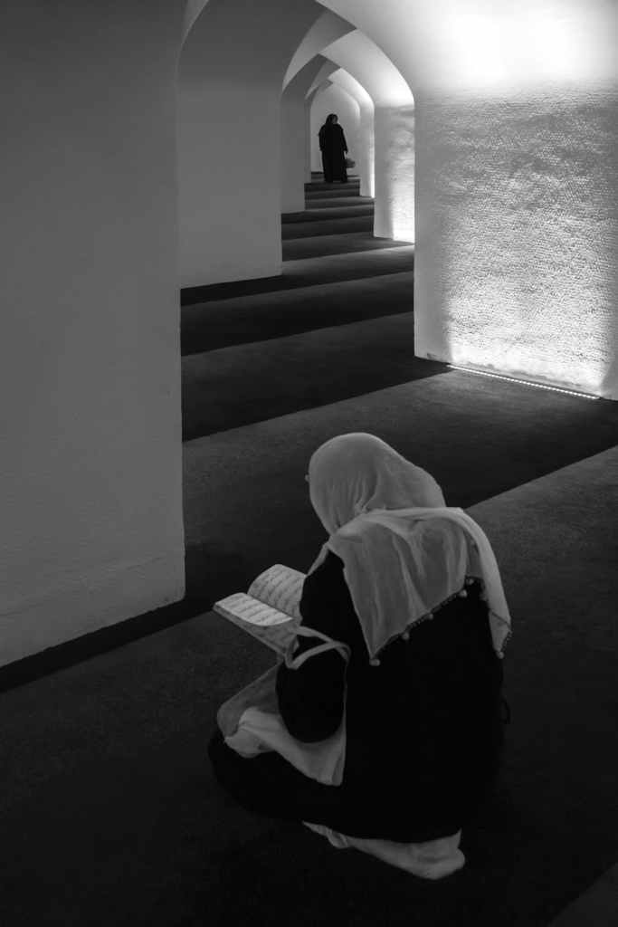 contemplative moment in tranquil mosque setting