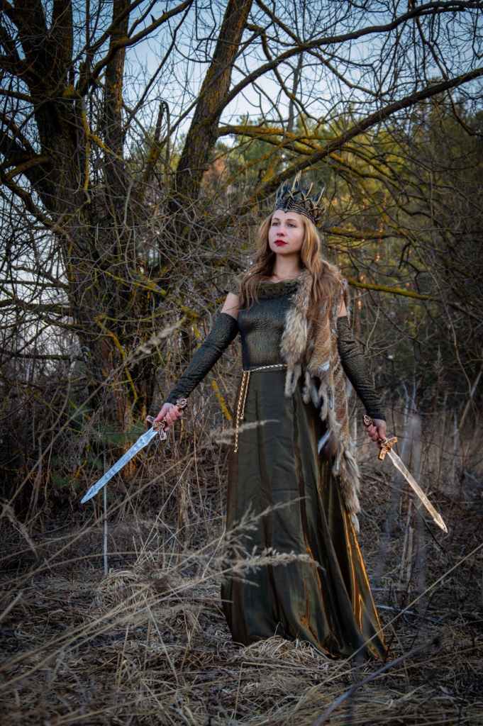 warrior queen in forest with dual swords
