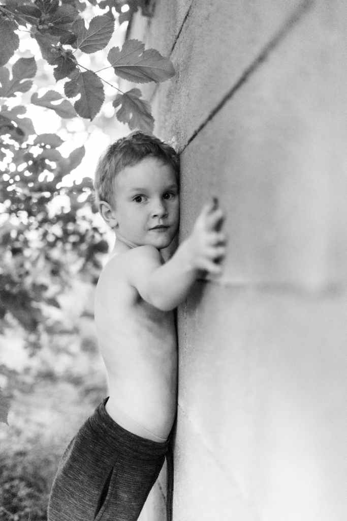 monochrome portrait of a young boy outdoors