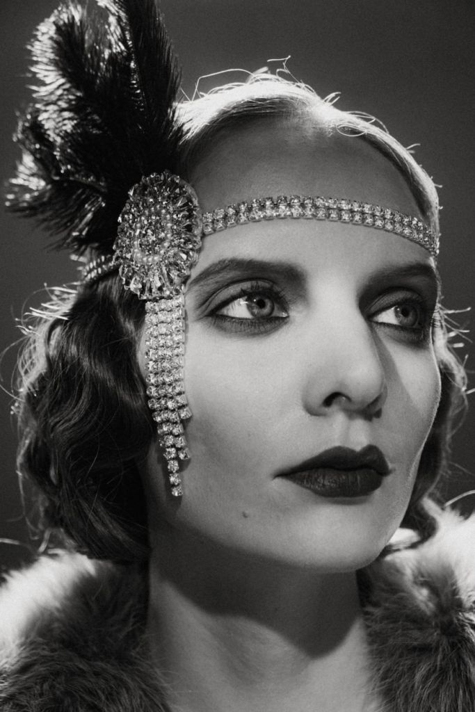 monochrome photo of a woman in a twenties outfit